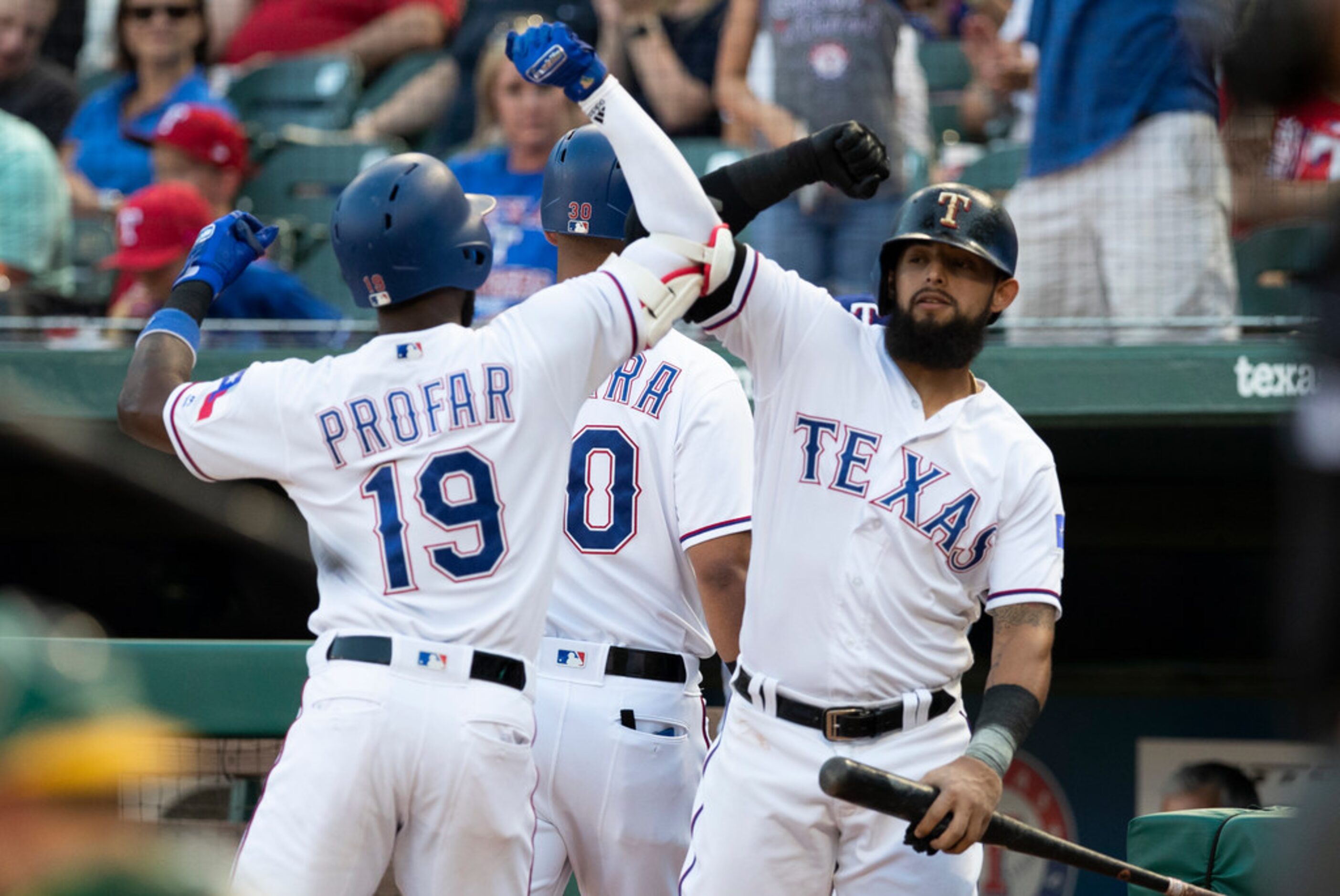 Texas Rangers' Jurickson Profar, left, celebrates his two run home run with Rougned Odor, as...