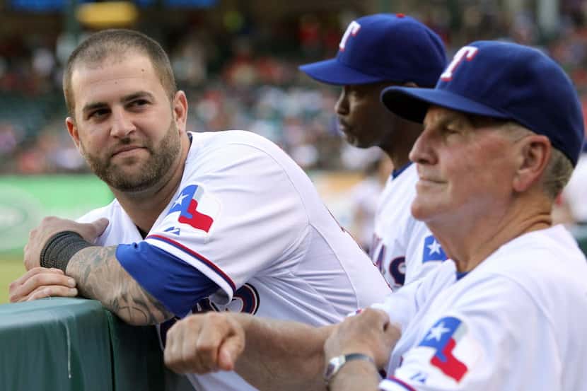 Texas catcher Mike Napoli and bench coach Jackie Moore are pictured during the Los Angeles...