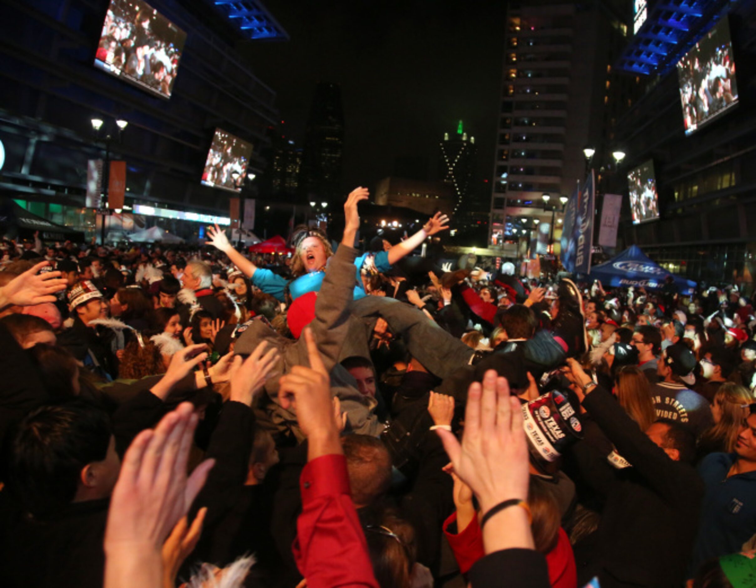 Crowd surfing at Big D New Years Eve celebration at American Airlines Center in Dallas...