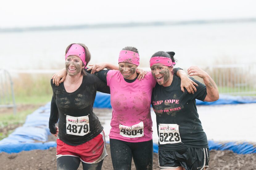 Women competing in the Dirty Girl Mud Run at Cedar Hill State Park on Saturday, Oct. 6,...