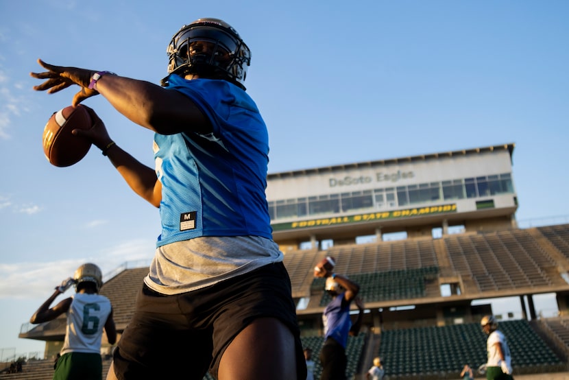 DeSoto’s quarterback DJ Bailey prepares to throw the ball during the first practice of the...