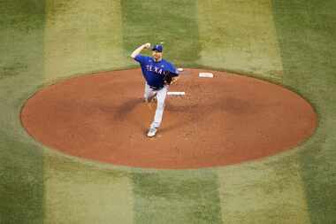 Texas Rangers starting pitcher Max Scherzer threw the ball during the first inning in Game 3...