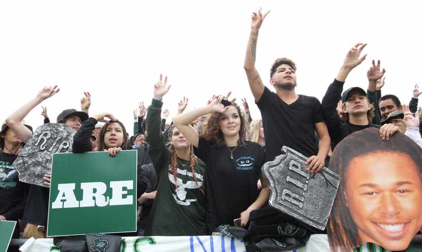A group of Mansfield Lake Ridge student fans await a second half kickoff following an Eagle...