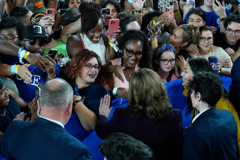 Democratic presidential nominee Vice President Kamala Harris greets supporters after...