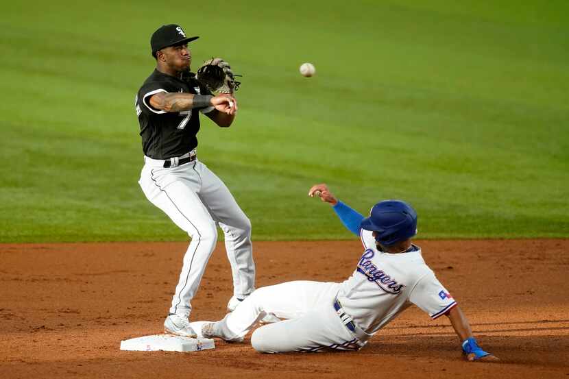 Chicago White Sox shortstop Tim Anderson throw to first to complete the double play after...