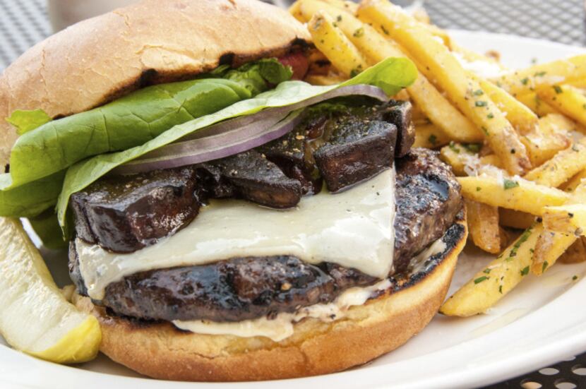 Truffle Pig burger with foie gras and truffle fries is served at Truffle Pig Restaurant in...