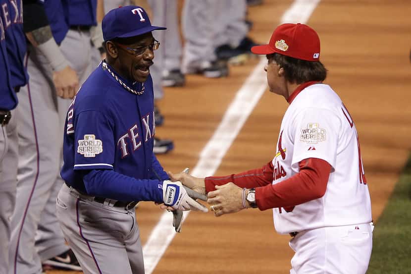 Managers Tony La Russa (right) of the St. Louis Cardinals and Ron Washington (left) of the...