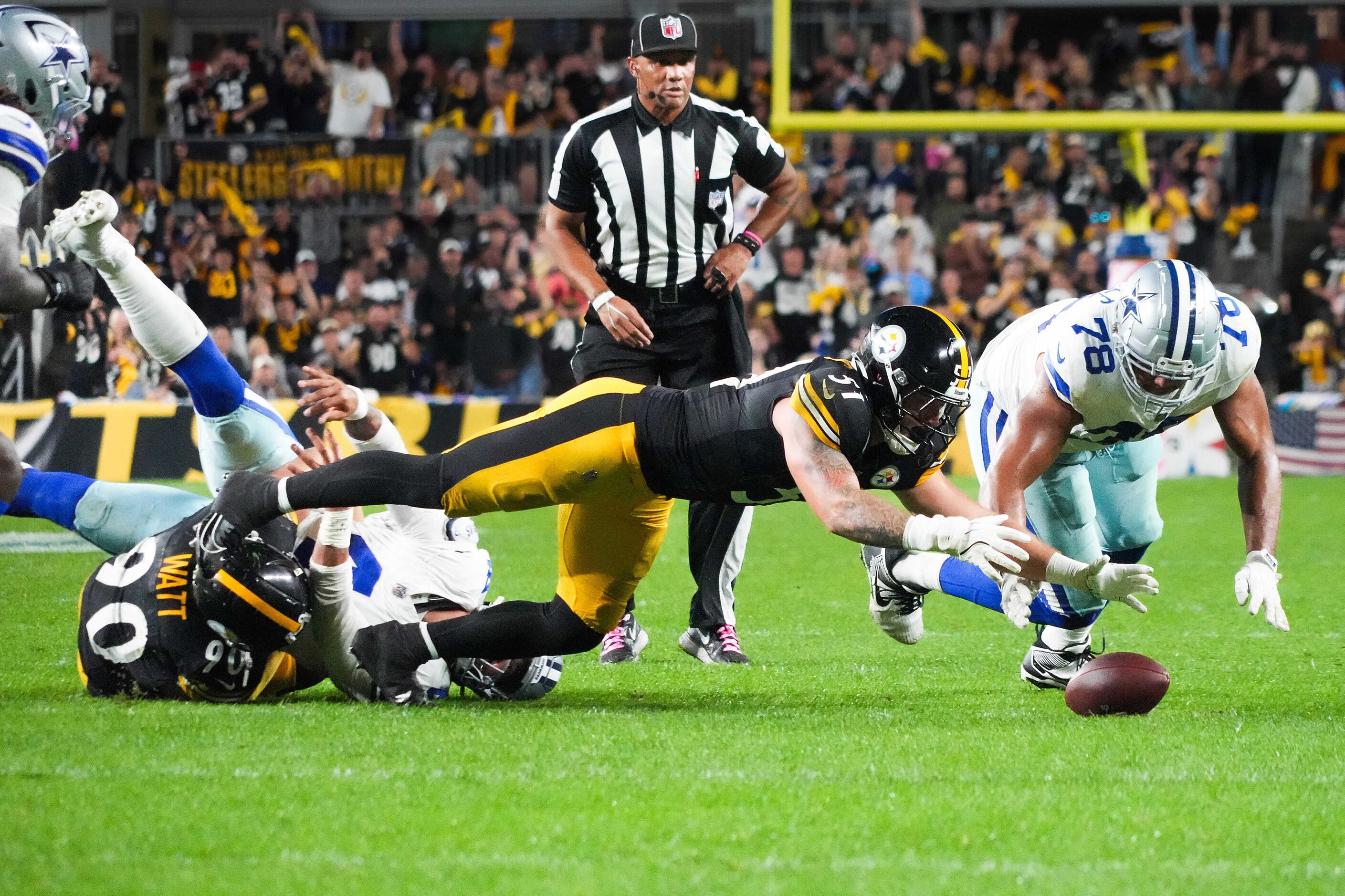 Pittsburgh Steelers linebacker Nick Herbig (51) pounces on a fumble by Dallas Cowboys...