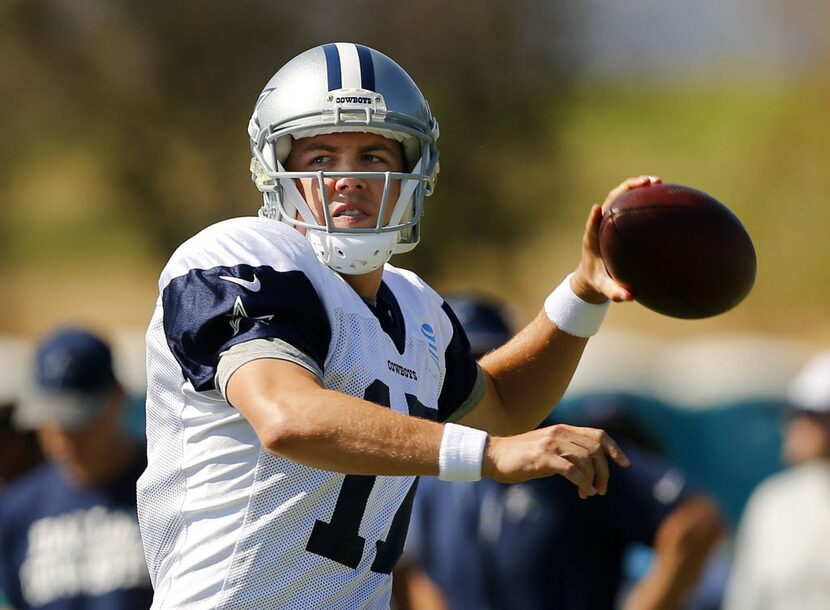 Dallas Cowboys quarterback Kellen Moore (17) looks for a receiver during afternoon practice...