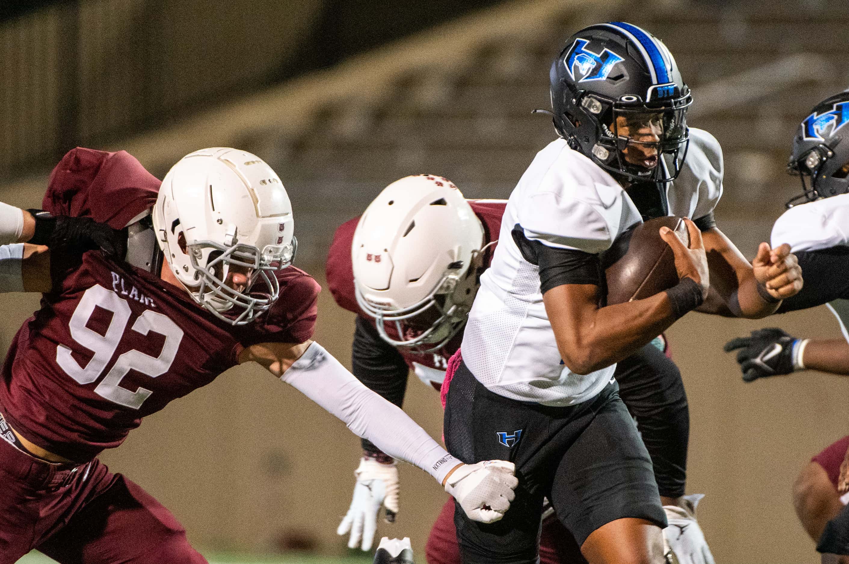 Hebron's Patrick Crayton Jr (10) rushes away from the grasp of Plano's Cruz Martin in the...