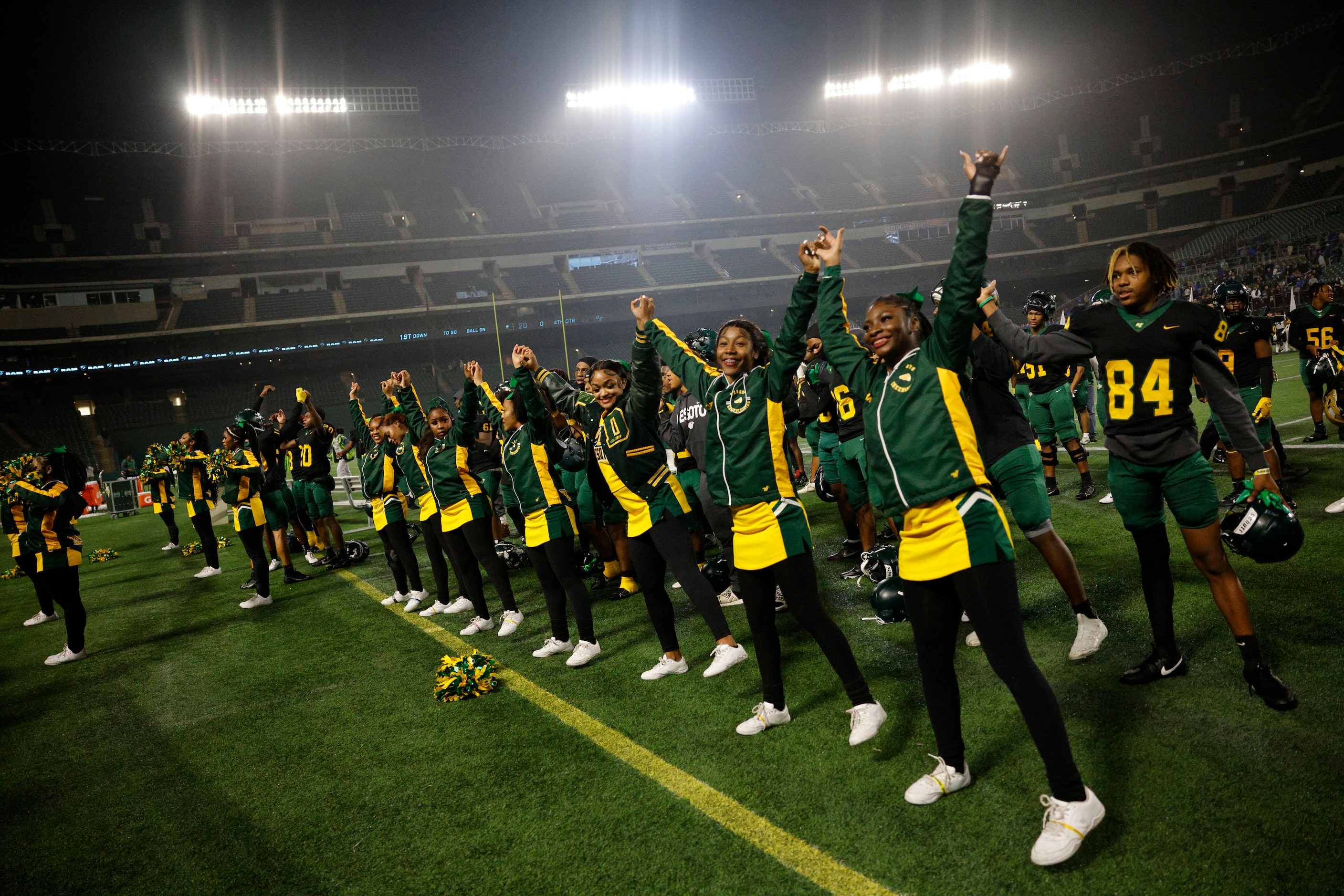 DeSoto cheerleaders and players celebrate after their 42-20 victory against Wylie East at a...