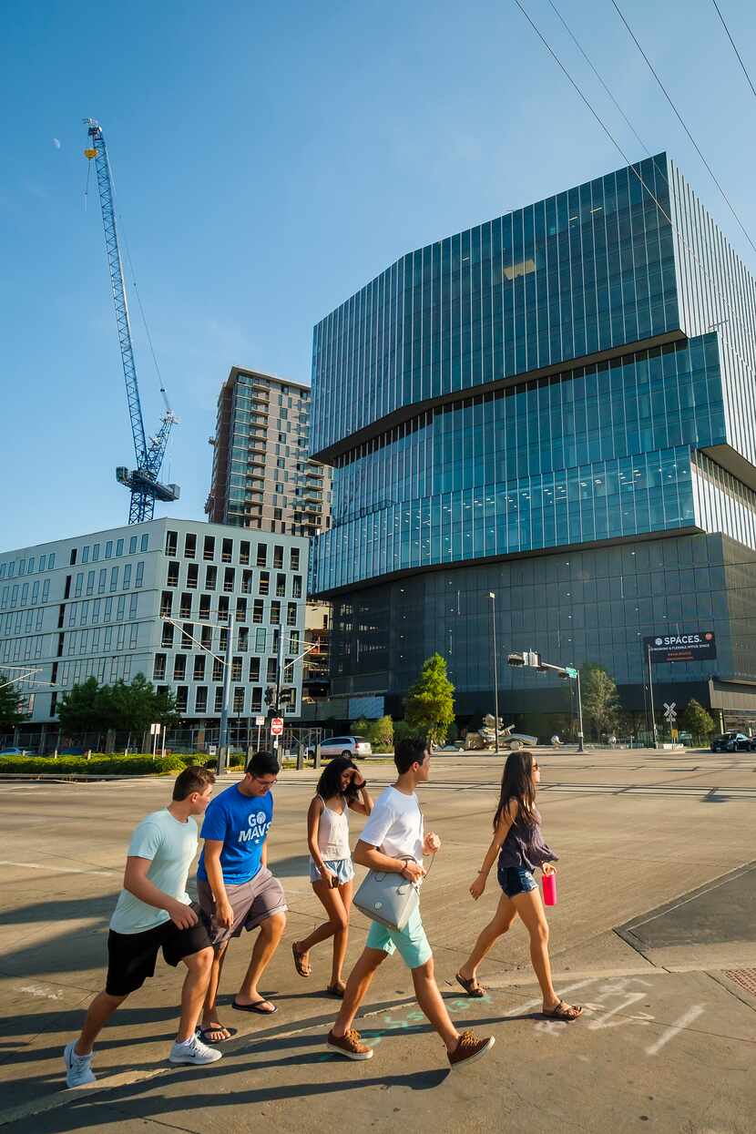 Pedestrians pass The Epic mixed-use development in Deep Ellum. It's one of the North Texas...