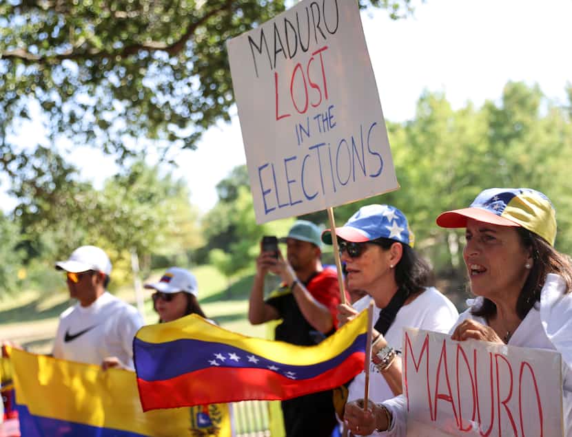 Venezuelan supporters chant during a protest against the official election results declaring...