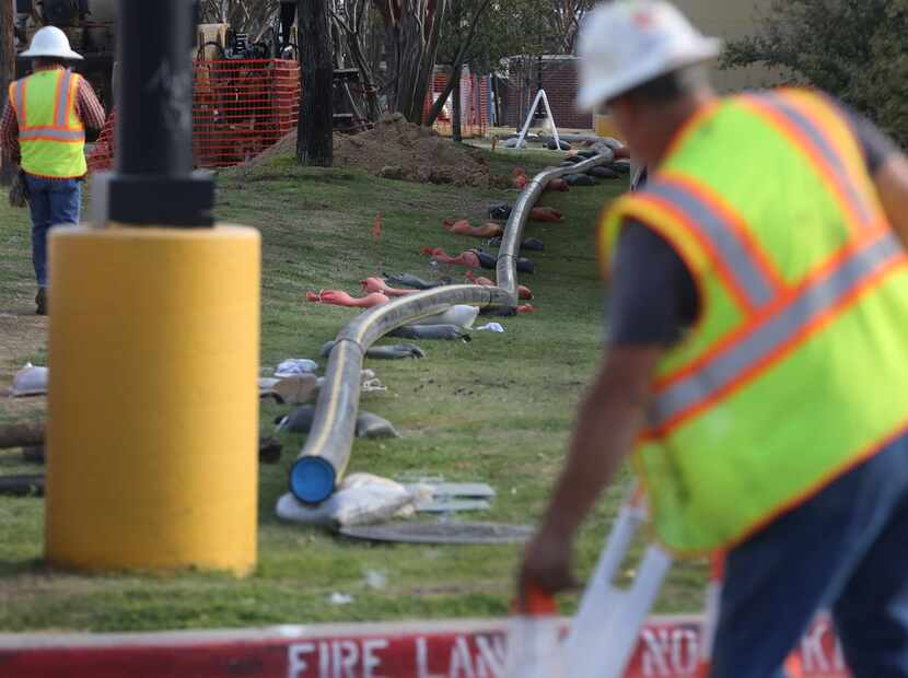 Crews worked last year along Midway Road to replace gas lines after one house exploded and...