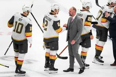 Dallas Stars head coach Pete DeBoer shakes hands with Vegas Golden Knights defenseman Zach...