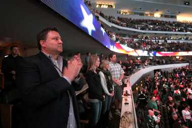 Dallas Stars owner Tom Gaglardi claps during the announcement of the Stars active military...