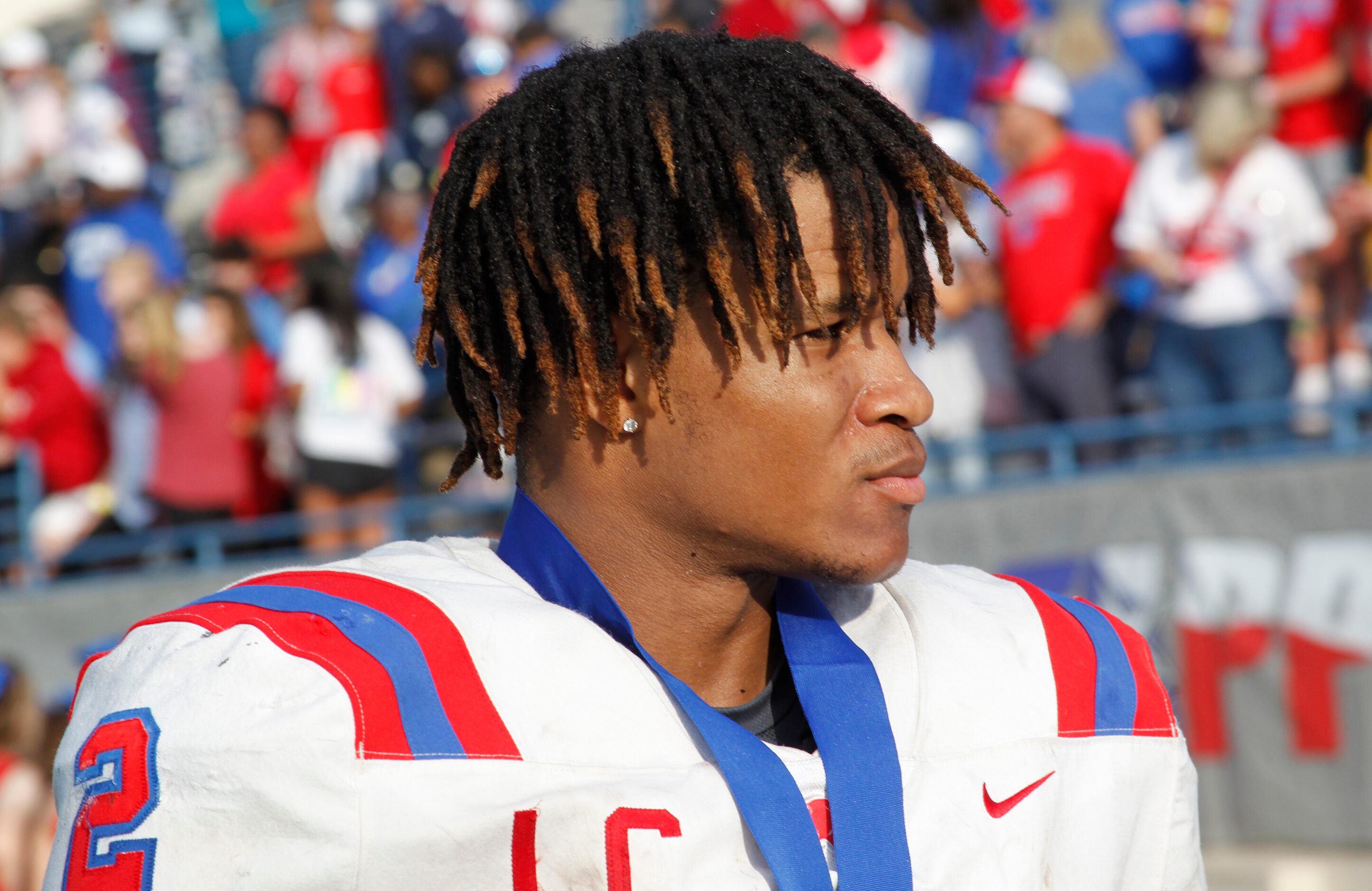 Parish Episcopal running back Andrew Paul (2) listens to a question from a media member...