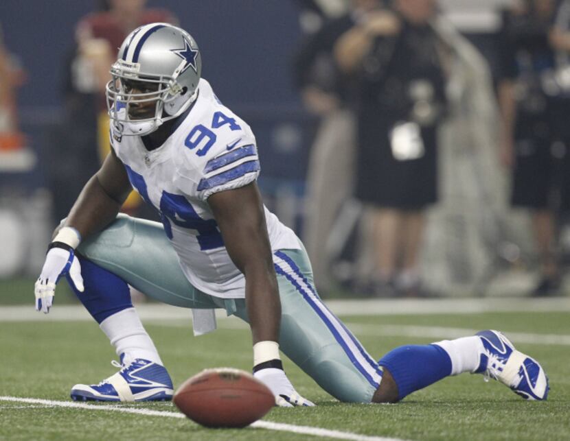 Dallas Cowboys defensive end DeMarcus Ware (94) stretches during their NFL football game...