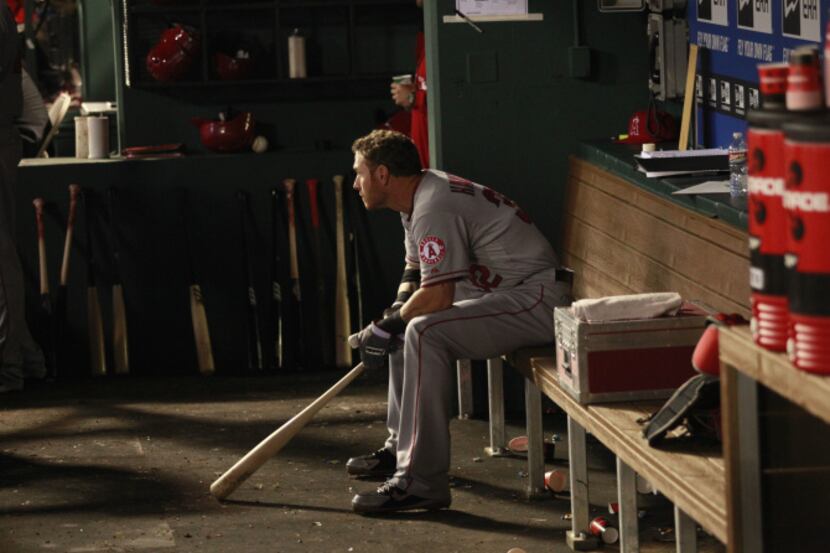 Los Angeles Angels left fielder Josh Hamilton (32) sits in the dugout before going up to bat...