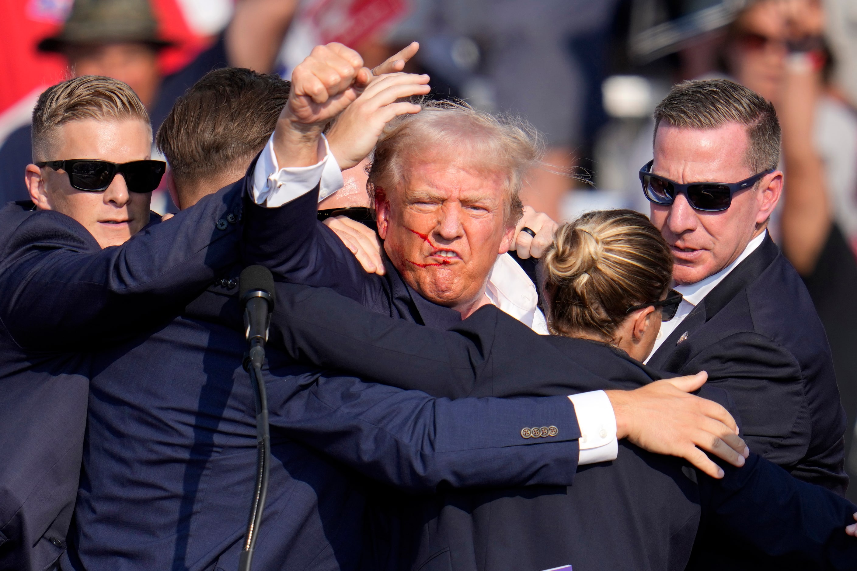 Republican presidential candidate former President Donald Trump pumps his fist as he is...