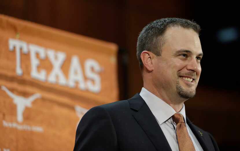 Tom Herman talks to the media during a news conference where he was introduced as Texas' new...