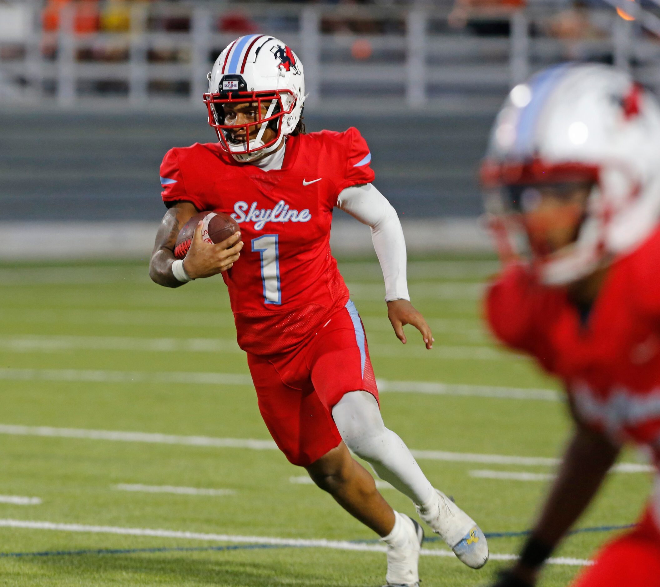 Skyline’s Damontae Oliver (1) runs for a couple of yards during the first half of a high...