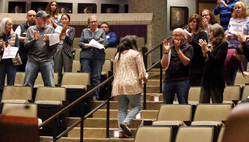 Zoey Sanchez returns to her seat during a standing ovation from supporters after speaking at...