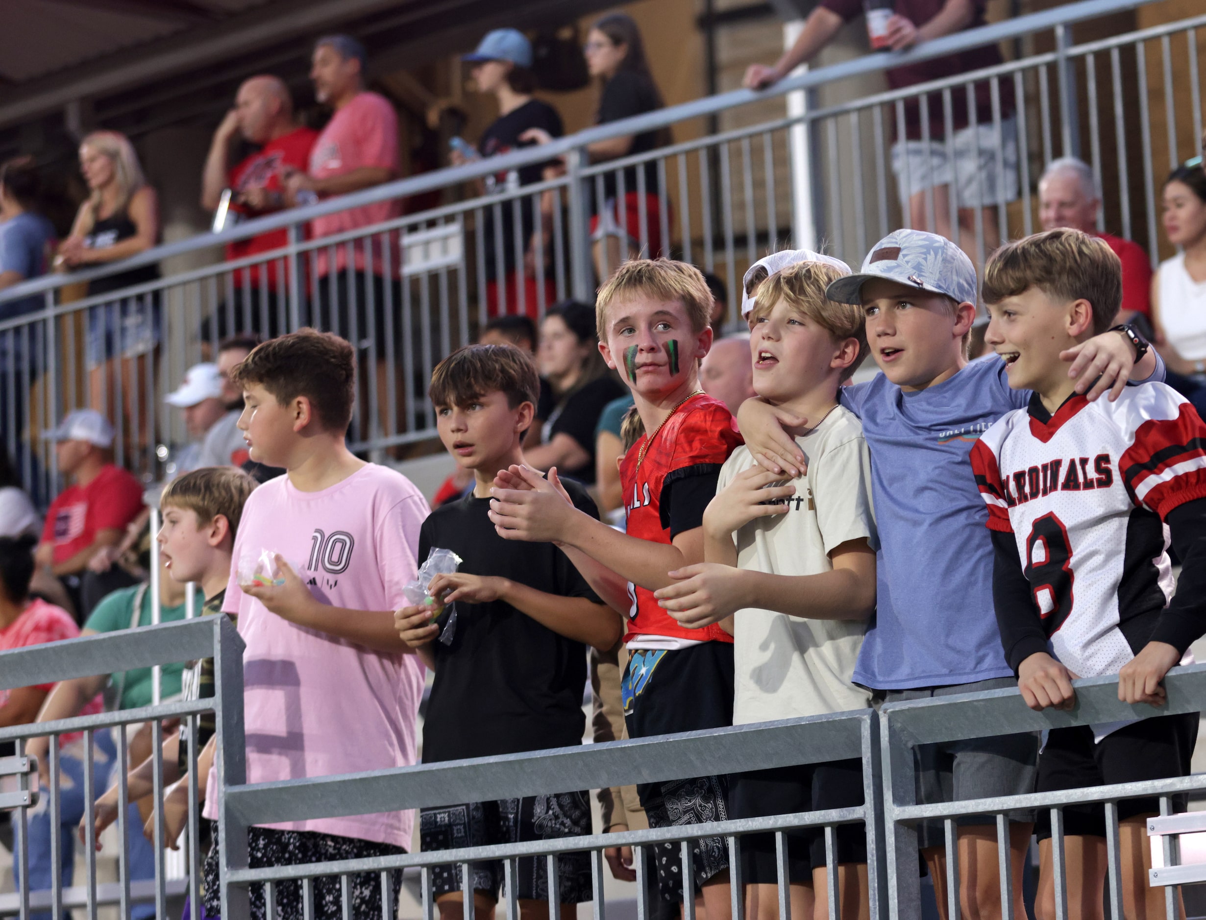 Melissa fans cheer after a touchdown during the Frisco Memorial High School at Melissa High...