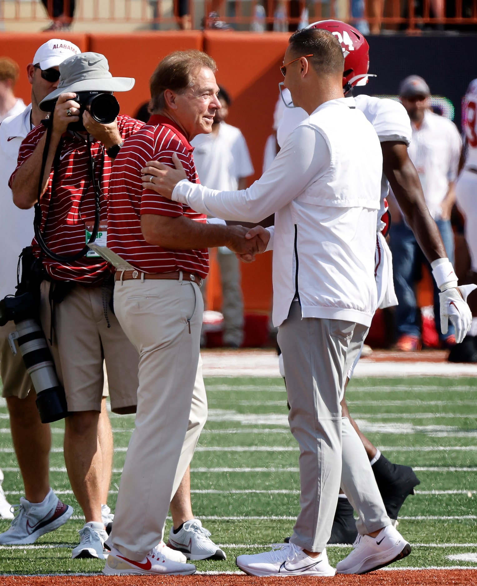 Texas Longhorns head football coach Steve Sarkisian (right) and Alabama Crimson Tide head...