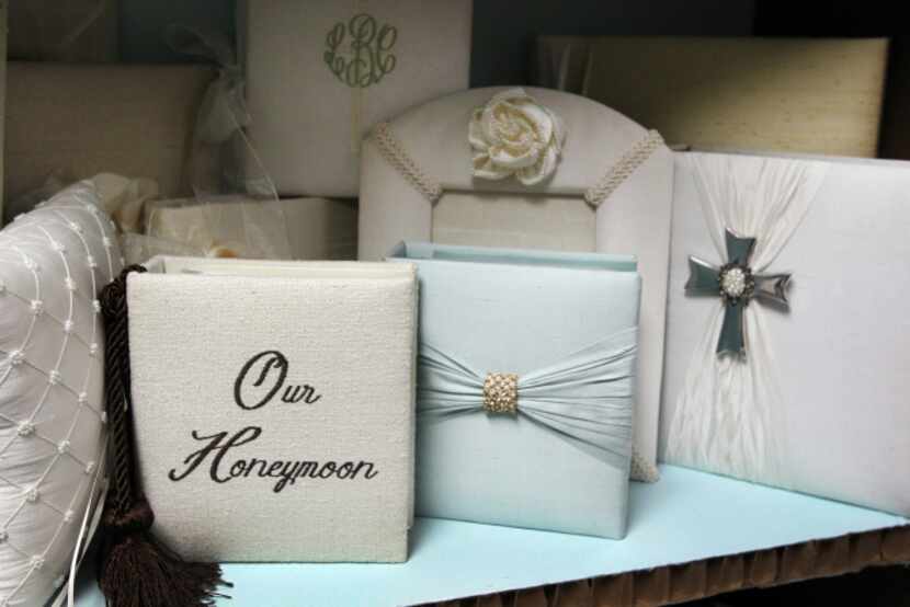 Some of the products designed by Jan Sevadjian, who makes keepsake boxes, photo albums and...