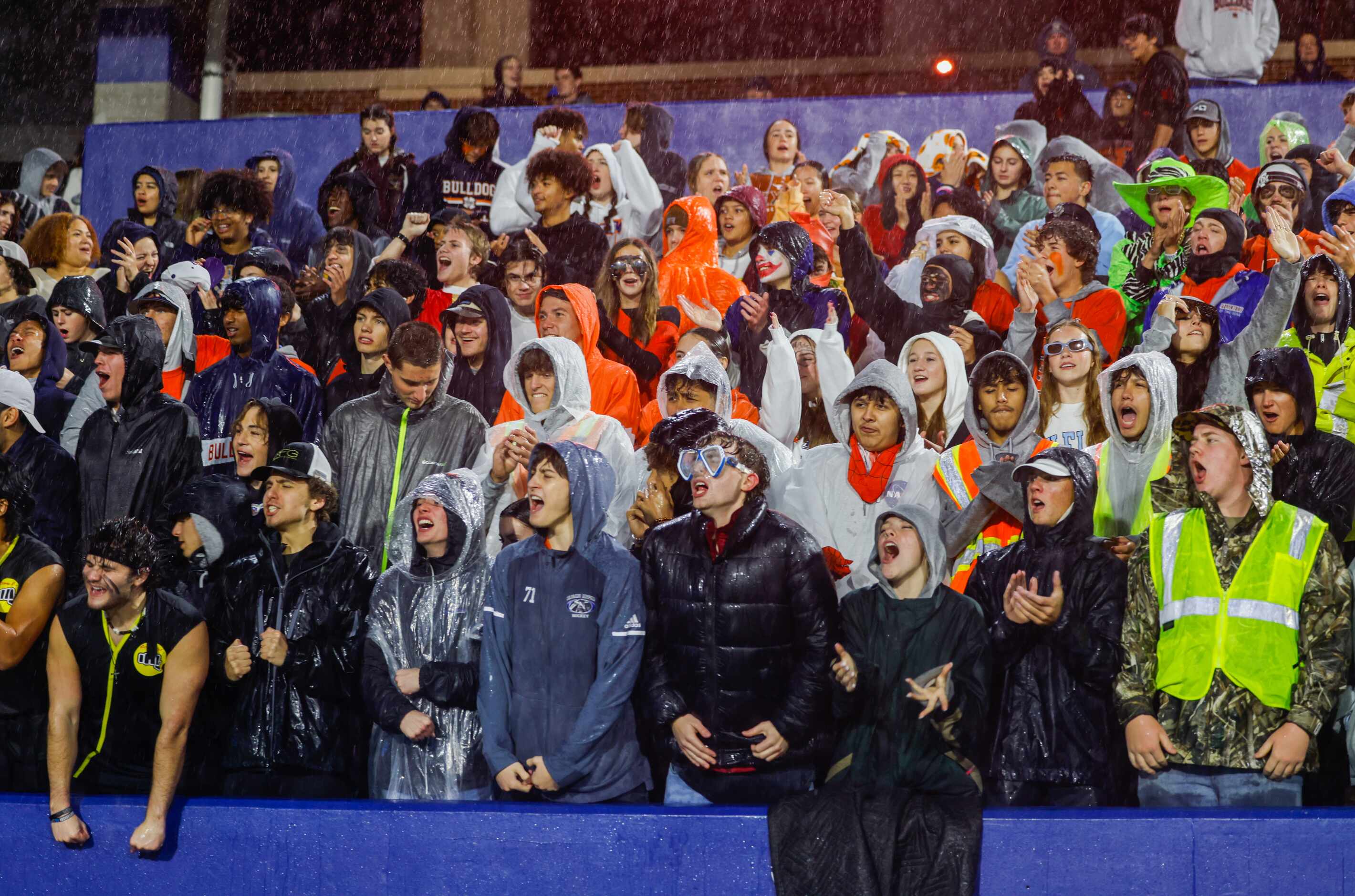 Bulldogs fans cheer on McKinney North as they enter the field to play Forney at the McKinney...