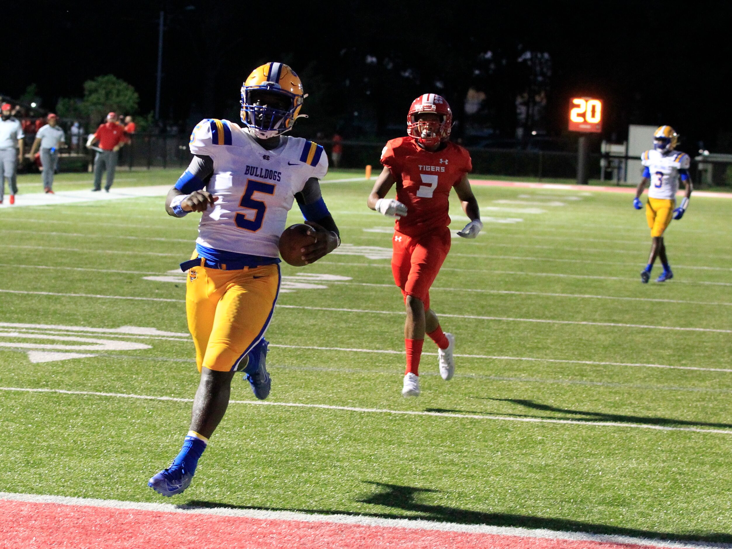 Chapel Hill QB Cameron Ford (5) crosses into the end zone for a touchdown during the first...