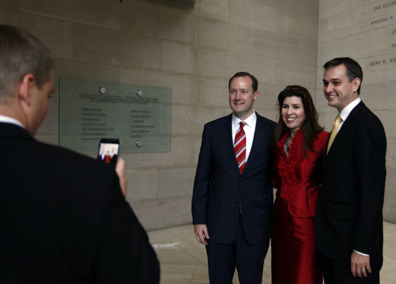 Newly sworn-in Dallas City Council members Philip Kingston (left), District 14, and Scott...