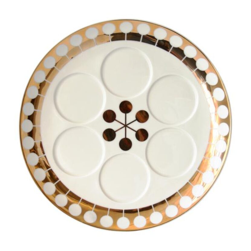 
Futura (below) by Jonathan Adler. $150 at Judaic Treasures at Temple Emanu-El, Dallas, and...