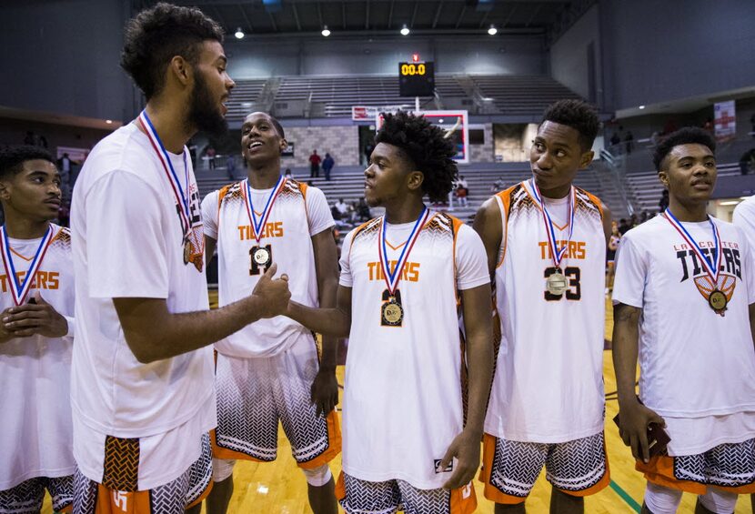 Lancaster celebrates a first place win at the Dallas ISD/Coca Cola Classic championship game...