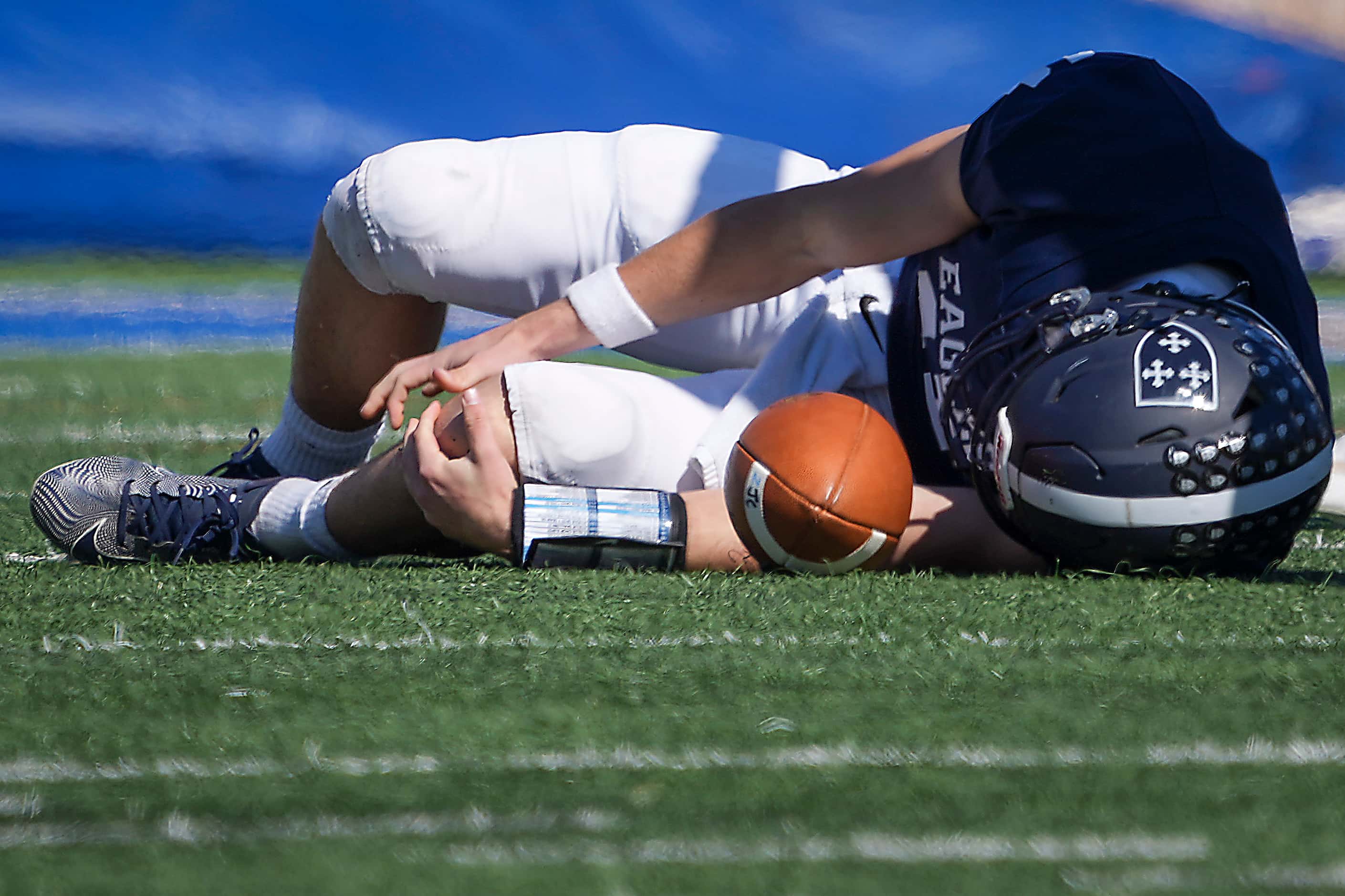 Episcopal School of Dallas quarterback Patrick Burke (11) is slow to get up after being...