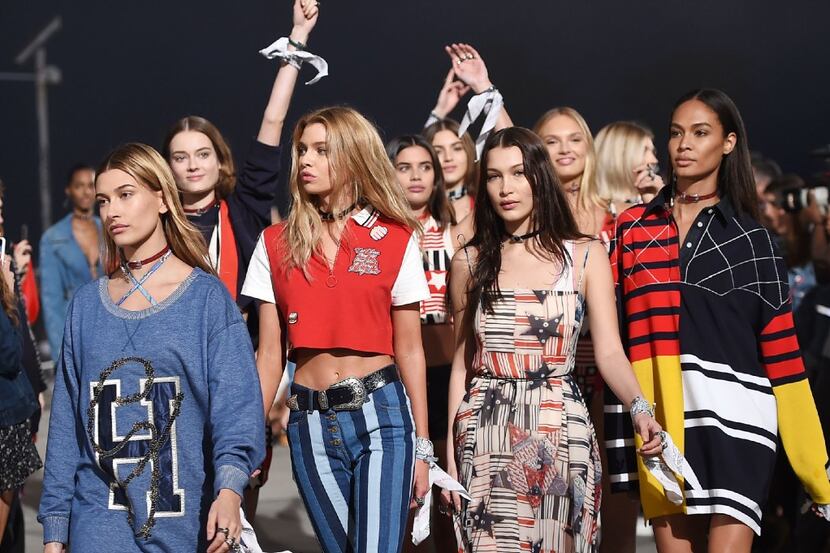 Models Hailey Baldwin (L), Bella Hadid (2R) and other models walk the runway at the...