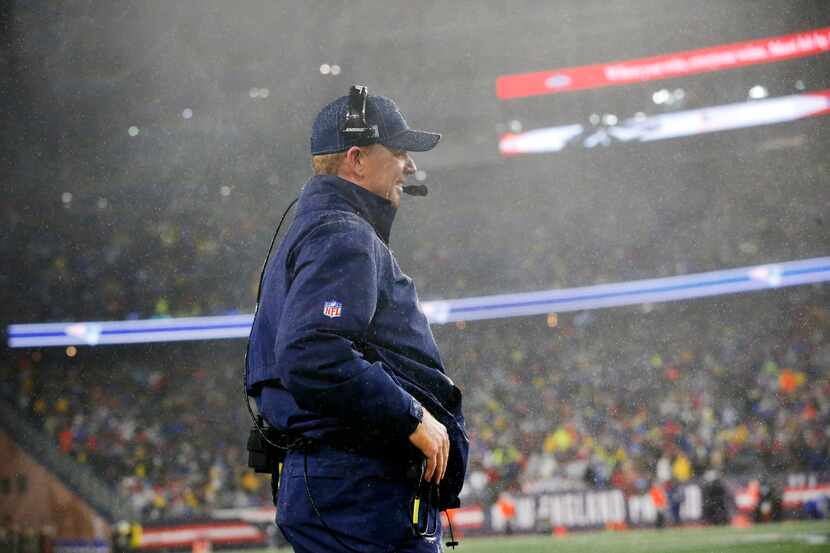 Dallas Cowboys head coach Jason Garrett was not immune to the driving wind and rain as he...