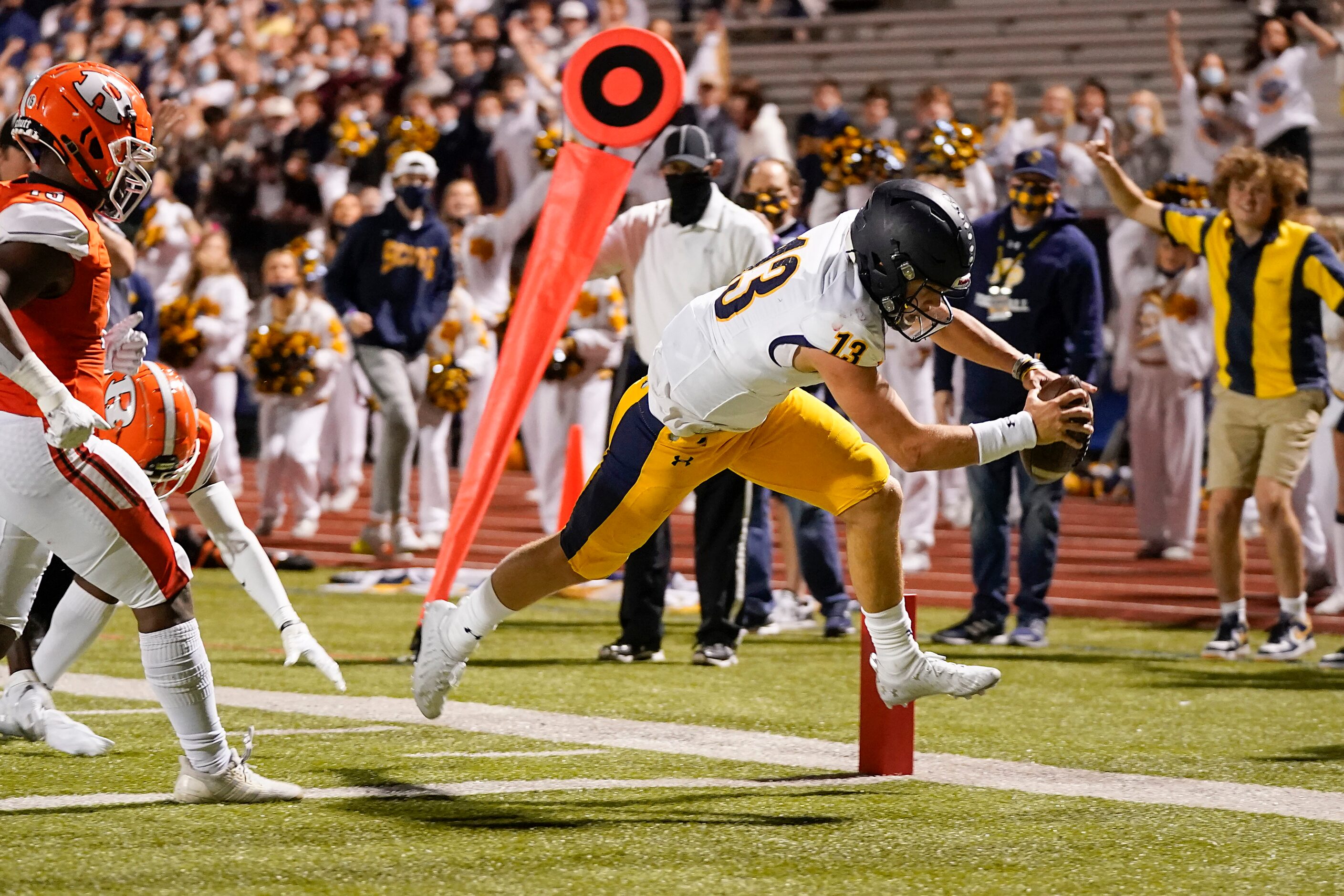 Highland Park quarterback Brayden Schager (13) gets past Rockwall linebacker Deyreck Dean...