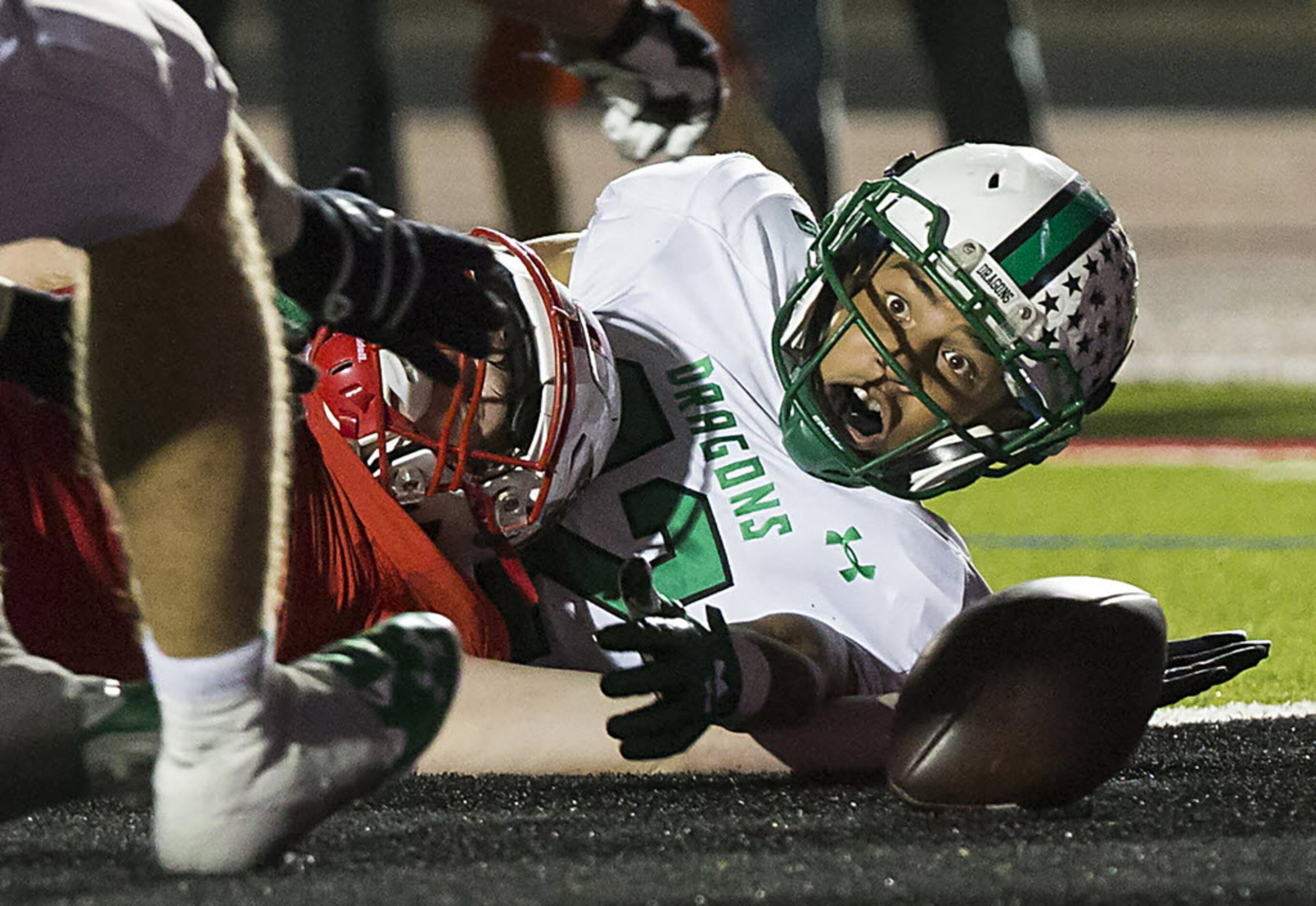 Southlake Carroll defensive back Robert Barnes (22) watches a the ball bounces away from...