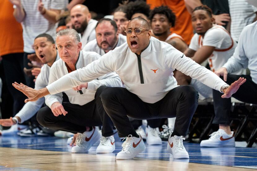 Texas acting head coach Rodney Terry guided his team during the second half of an NCAA...