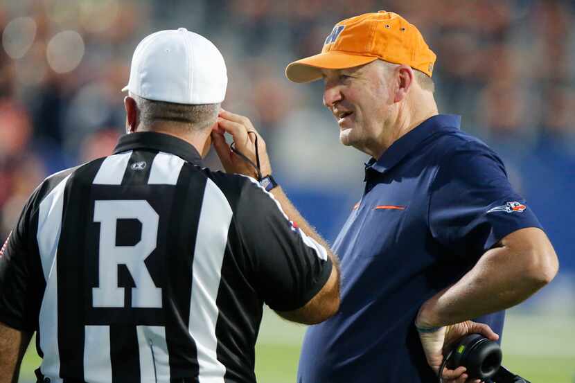 Frisco Wakeland coach Marty Secord talks with an official during the first half as McKinney...