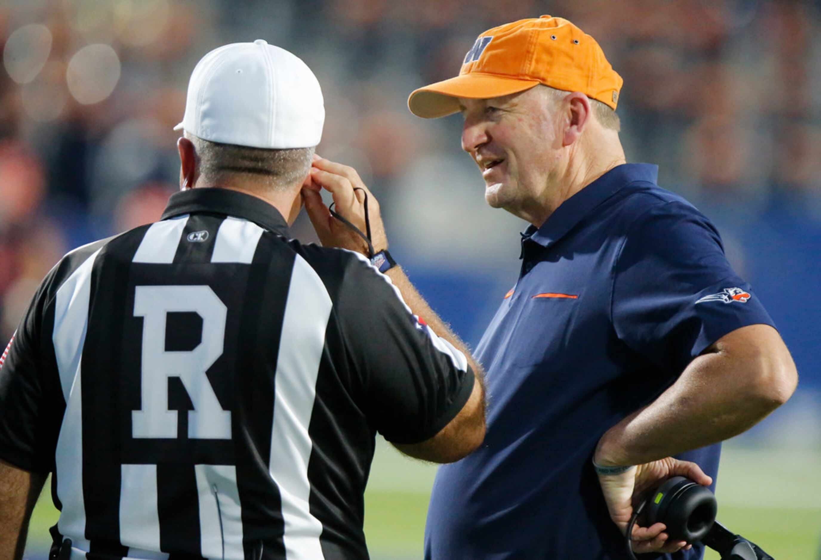 Wakeland High School head coach Marty Secord questions a ref during the first half as...