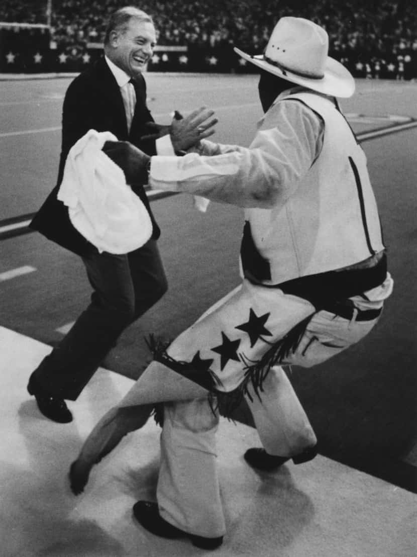 09/02/1992--  Jerry Jones dances with Crazy Ray at the end of a Cowboys game.