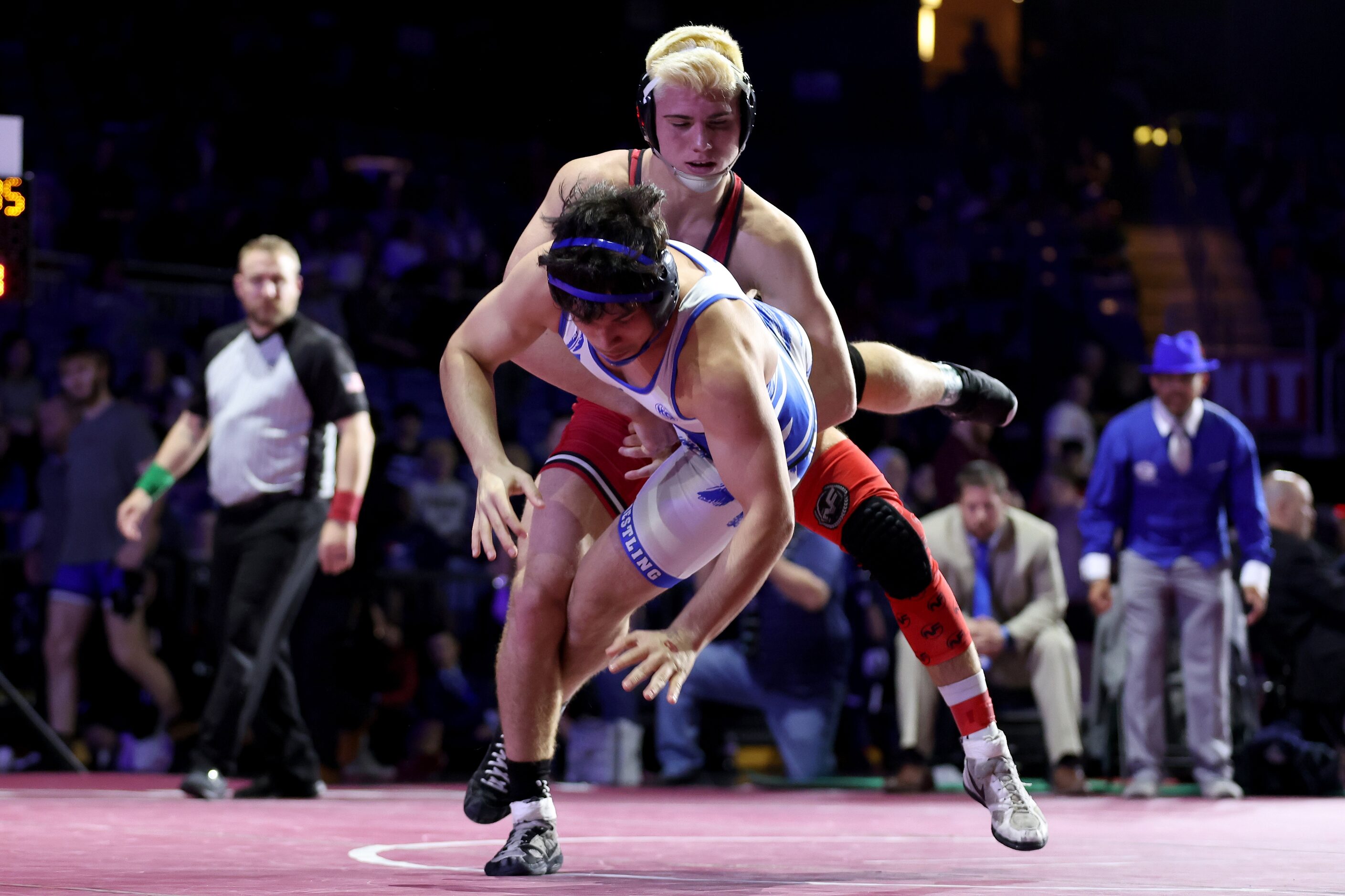 Angelo Ferrari of Melissa (red) competes against Isaac Zapata of Georgetown in the Boys 5A...