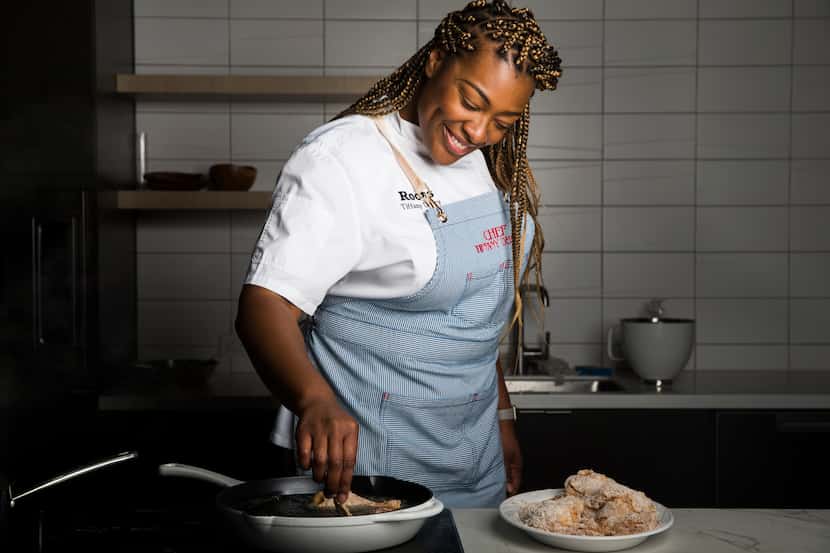 Tiffany Derry of Roots Chicken Shak fries chicken on Feb. 4, 2020 at The Dallas Morning News...