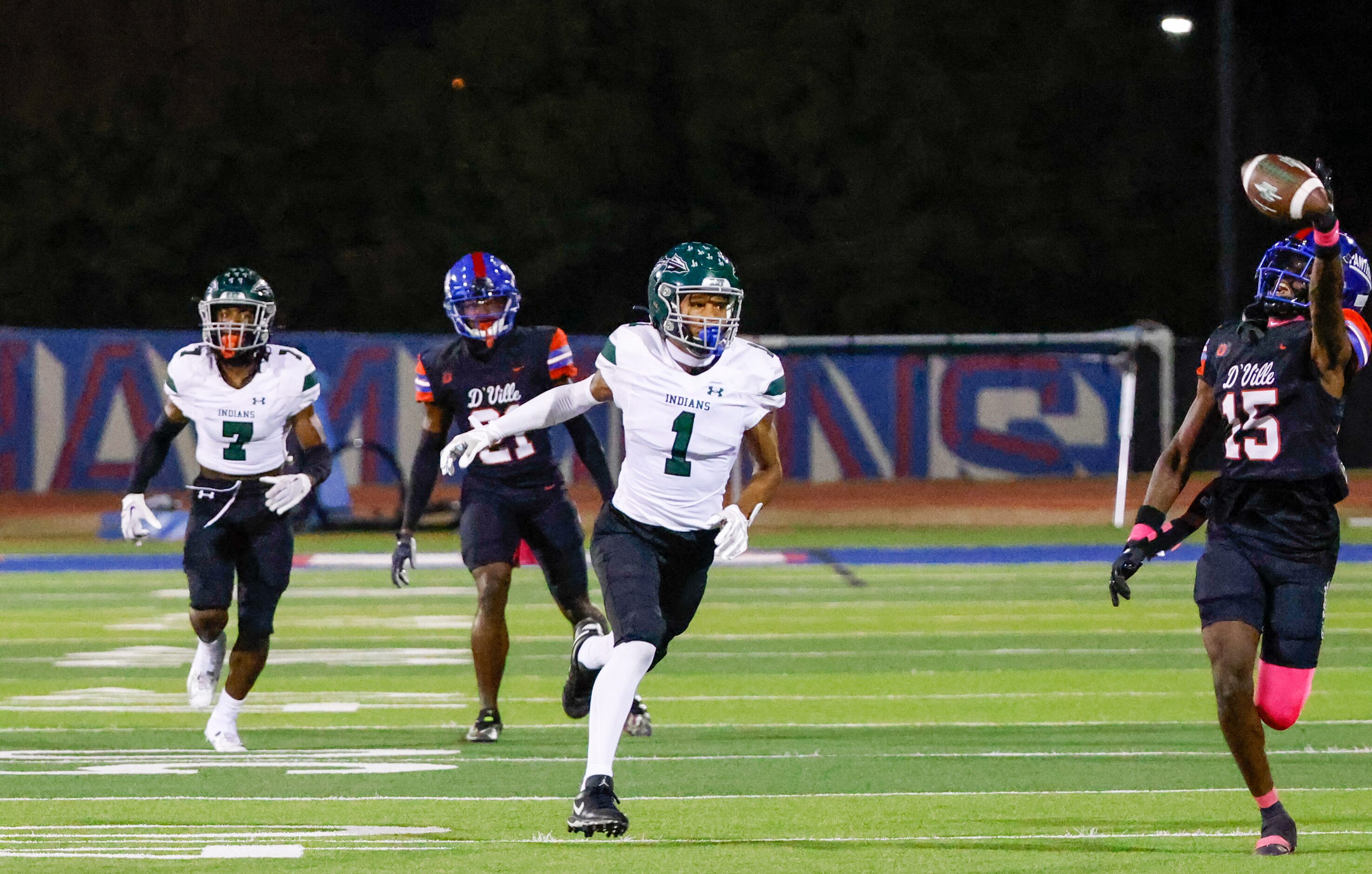 Duncanville defensive back Lamoderick Spencer (15) reaches toward a pass intended for...