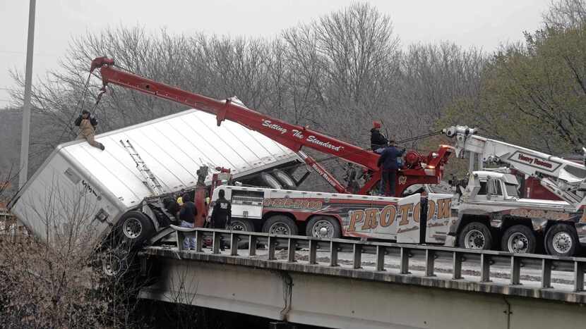 
Crews continued to try remove a tractor-trailer from a guardrail on northbound I-45 in Oak...