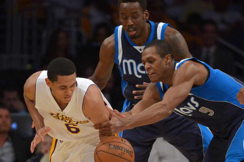 Mar 8, 2015; Los Angeles, CA, USA; Los Angeles Lakers guard Jordan Clarkson (6) and Dallas...