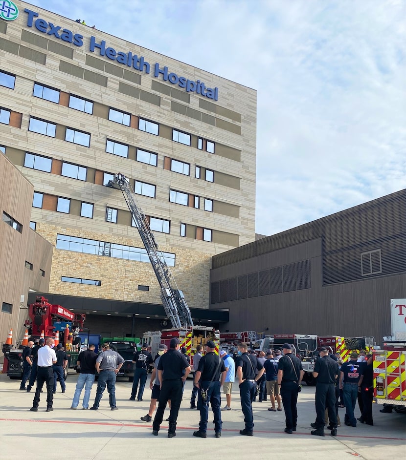 North Texas firefighters visit injured friend at Texas Health Hospital in Frisco on July 6,...